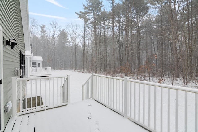 view of snow covered deck