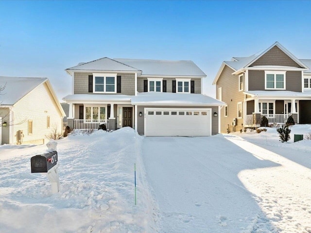 view of front of home featuring a garage and a porch