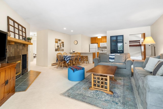 living room featuring a fireplace and carpet