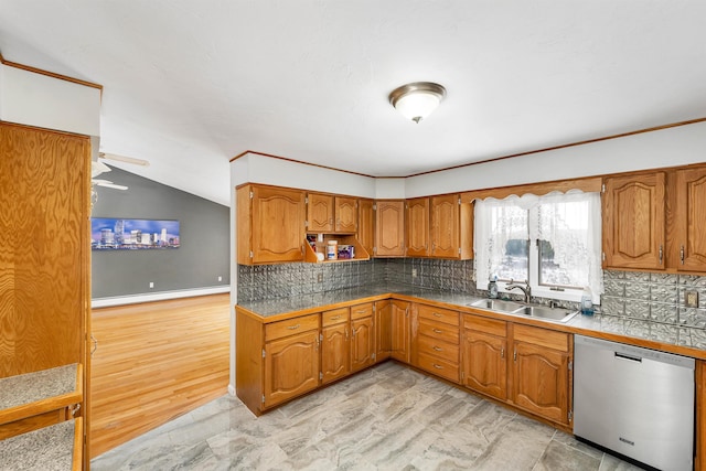 kitchen with lofted ceiling, sink, dishwasher, baseboard heating, and decorative backsplash