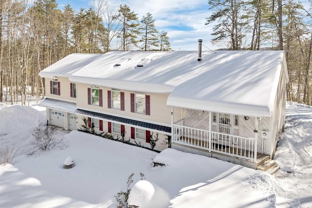 view of front of house with a garage and a porch