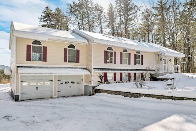 view of front of property featuring a porch and a garage