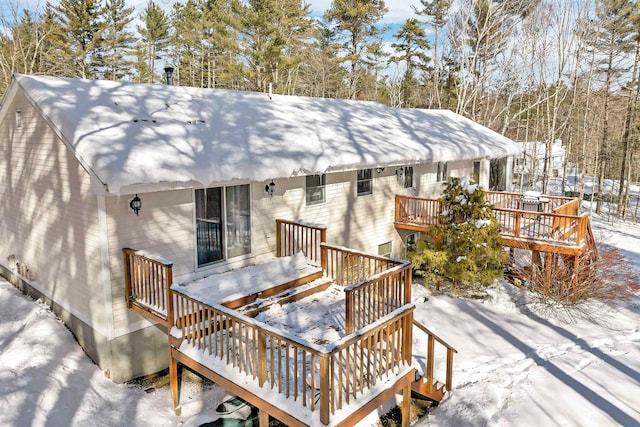 view of snow covered deck