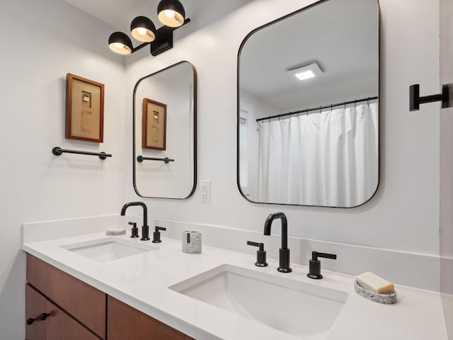 bathroom with vanity and a shower with curtain