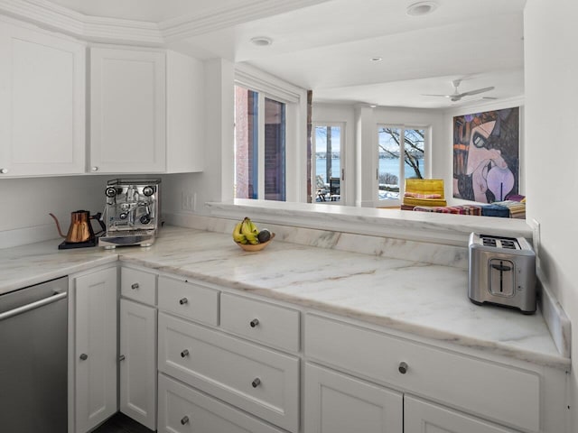 kitchen with light stone countertops, stainless steel dishwasher, white cabinets, and ceiling fan