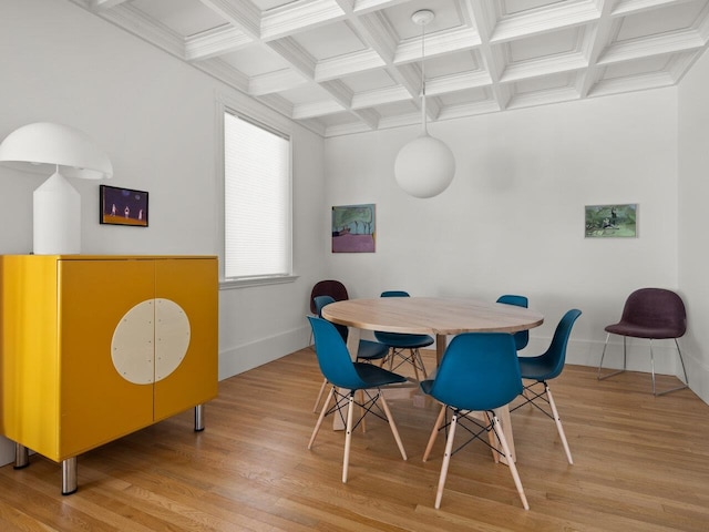 dining room with coffered ceiling, hardwood / wood-style floors, ornamental molding, and beamed ceiling