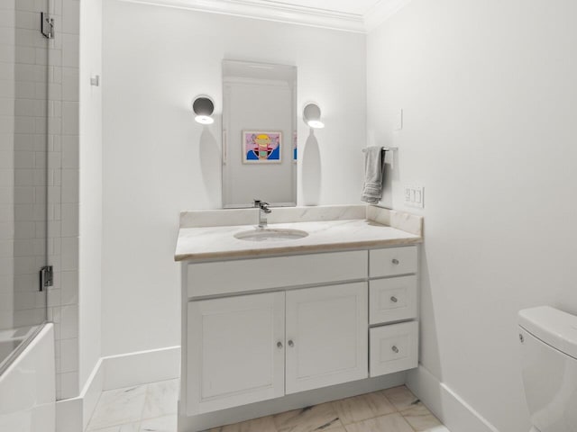 full bathroom featuring vanity, combined bath / shower with glass door, ornamental molding, and toilet