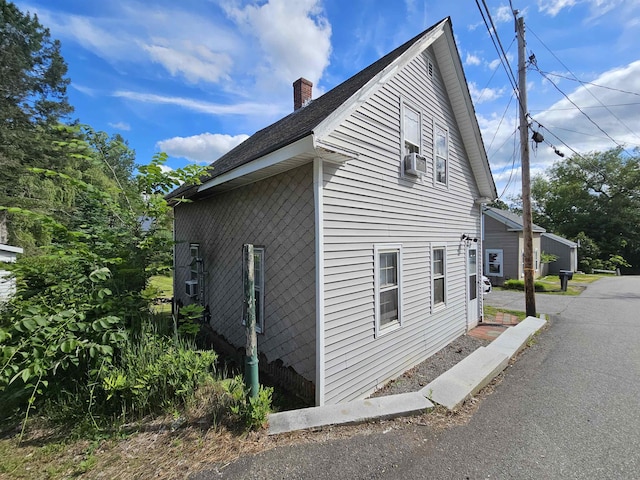 view of property exterior featuring cooling unit