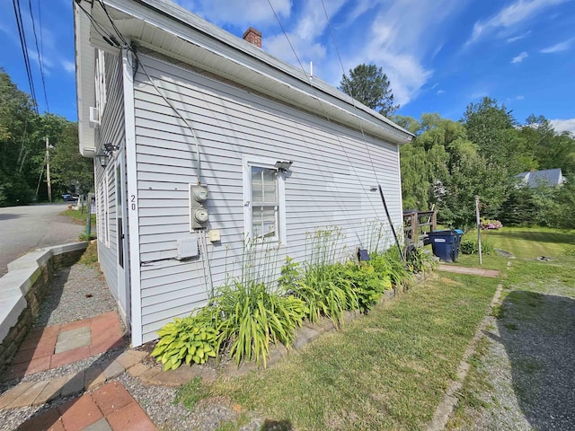 view of home's exterior with a yard