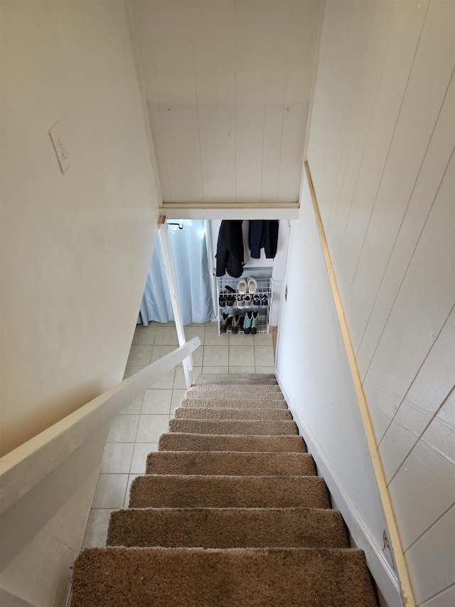 stairs featuring tile patterned floors