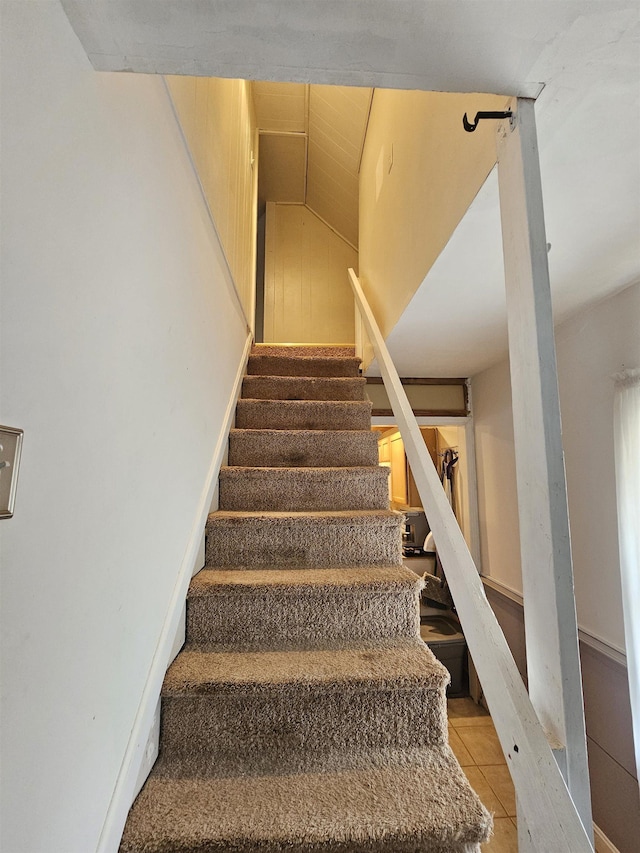 stairs with tile patterned flooring