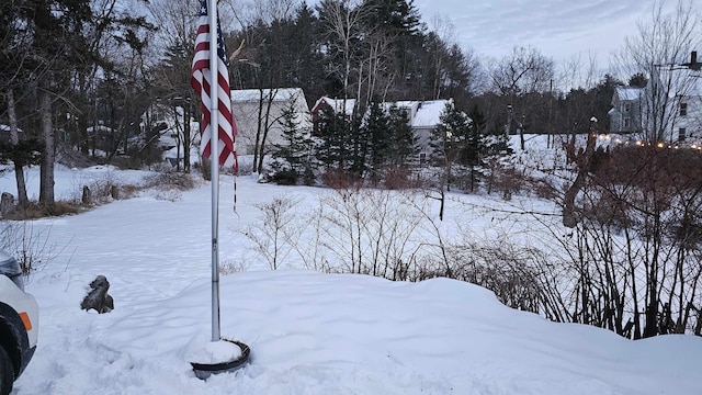 view of yard layered in snow