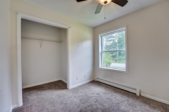 unfurnished bedroom featuring ceiling fan, a baseboard radiator, a closet, and carpet