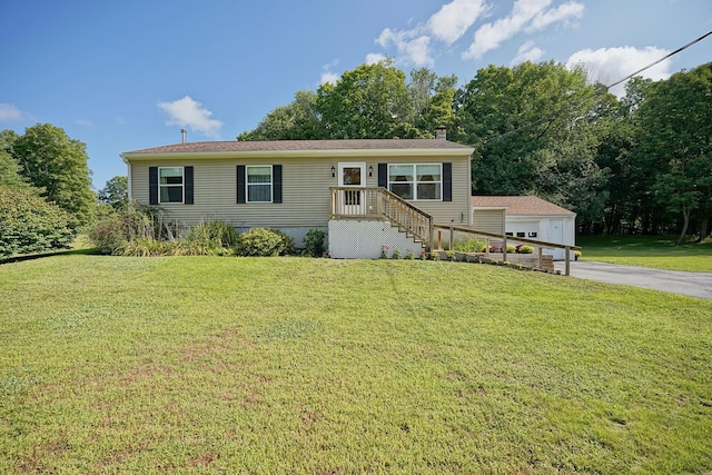 view of front facade with a garage and a front lawn