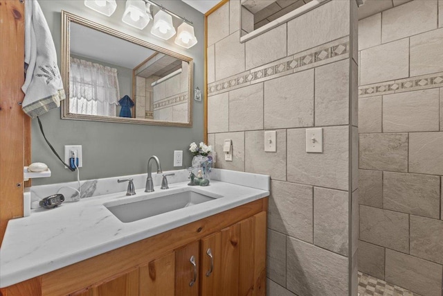 bathroom featuring vanity and a tile shower