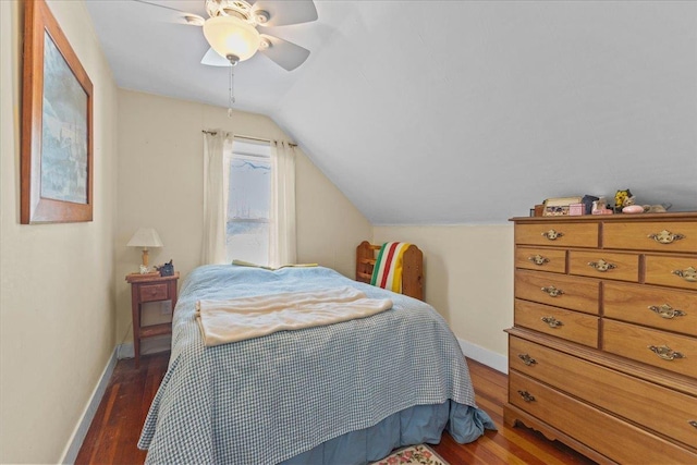 bedroom featuring ceiling fan, lofted ceiling, and dark hardwood / wood-style floors