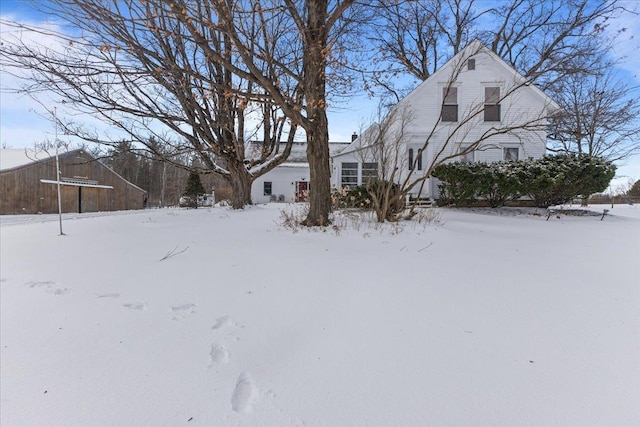 view of yard covered in snow