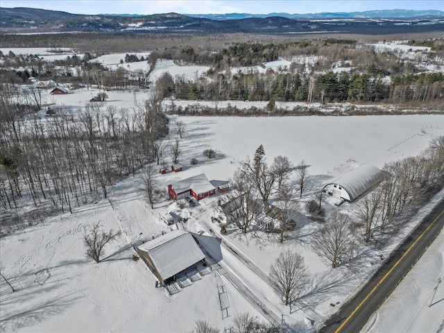 snowy aerial view with a mountain view