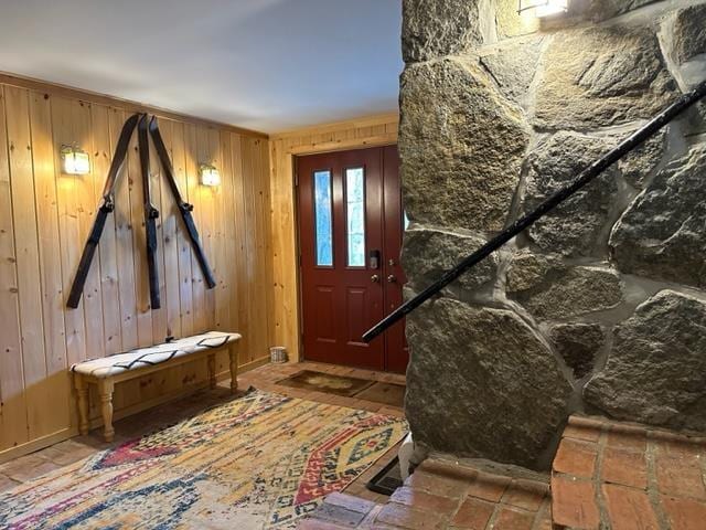 mudroom with wood walls