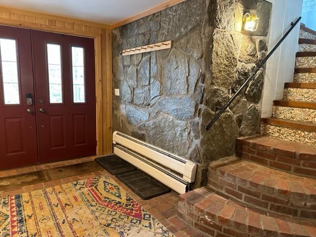 entryway featuring baseboard heating