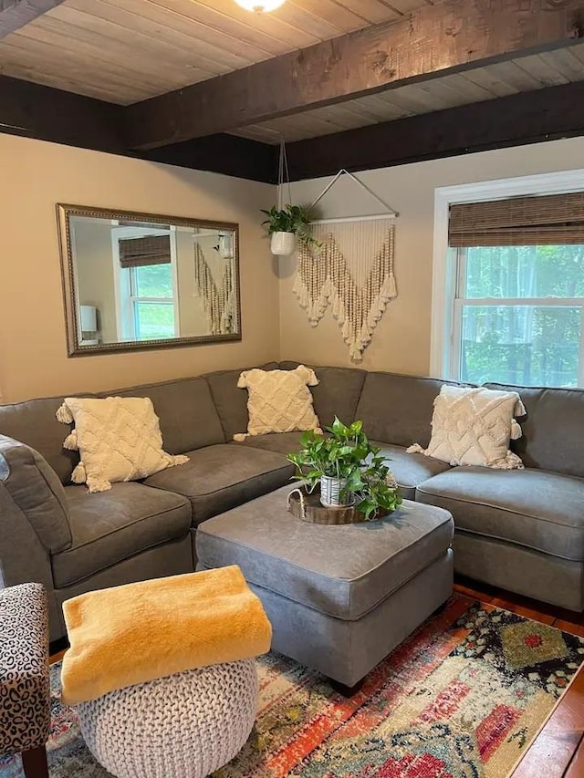 living room with beam ceiling and wood ceiling