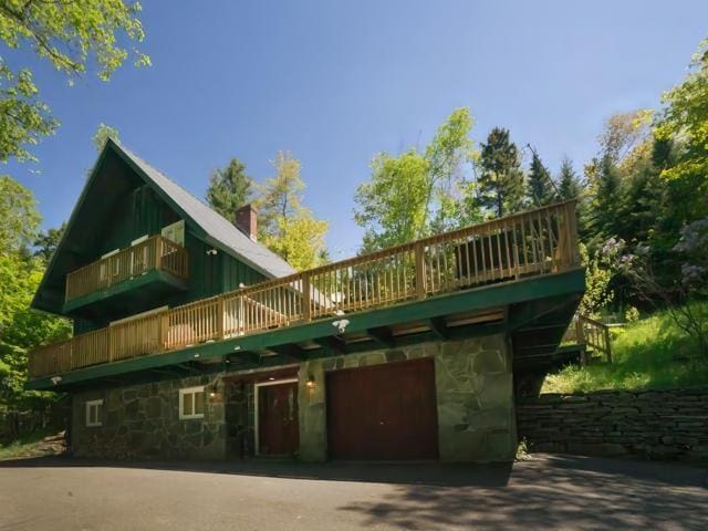 rear view of house with a garage