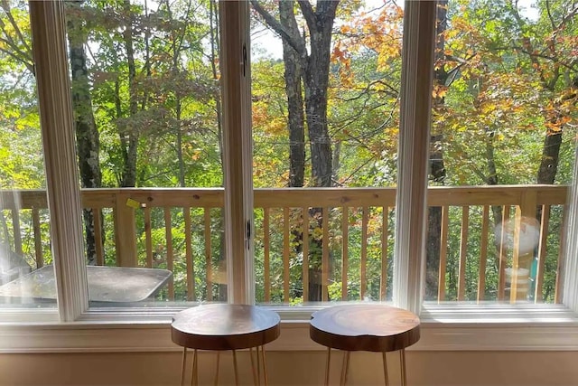 unfurnished sunroom featuring a wealth of natural light