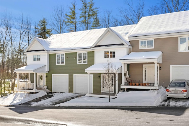 view of front of property with a garage and covered porch