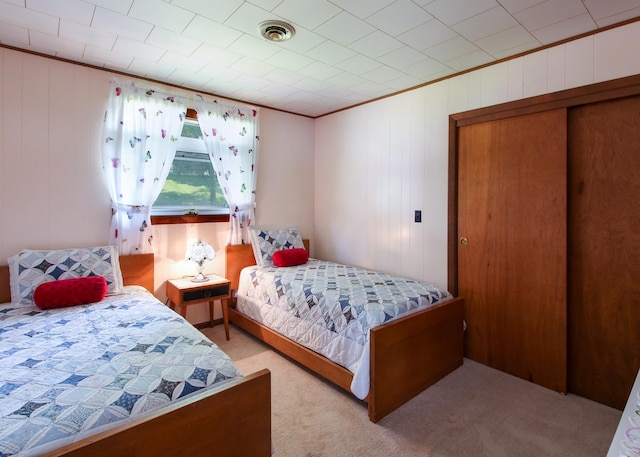 carpeted bedroom with crown molding