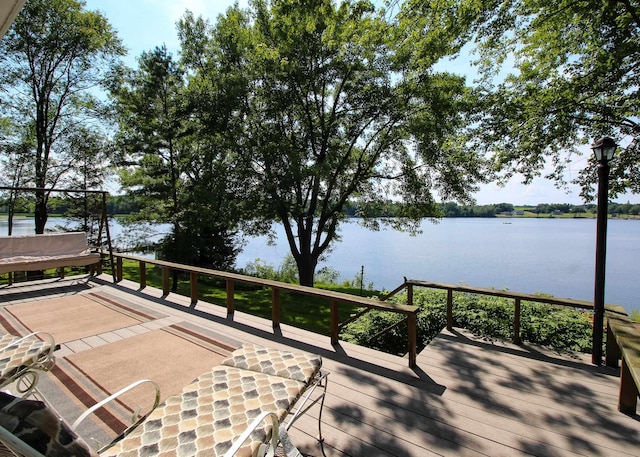 deck featuring a water view