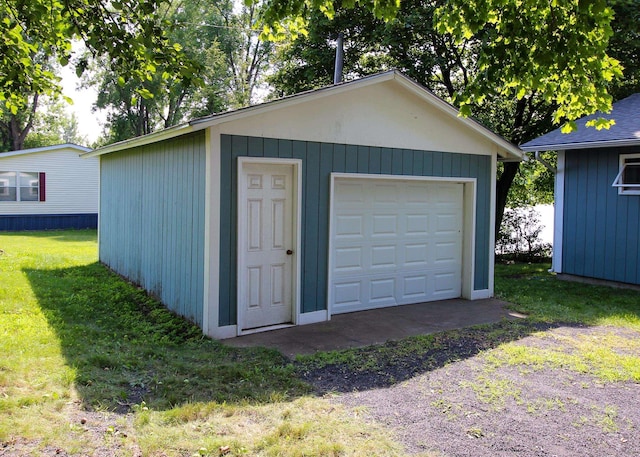 garage with a lawn