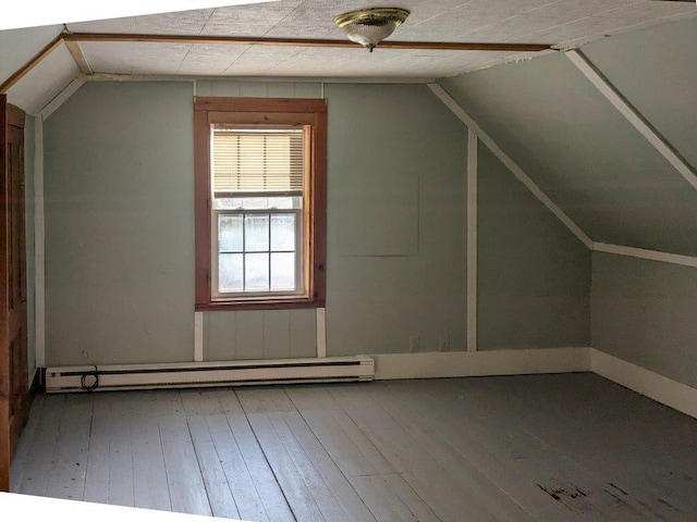 bonus room featuring lofted ceiling, hardwood / wood-style floors, and baseboard heating