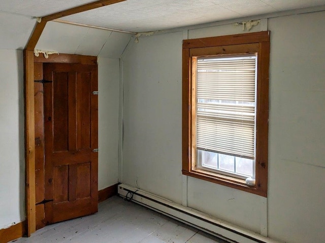 empty room featuring a baseboard radiator