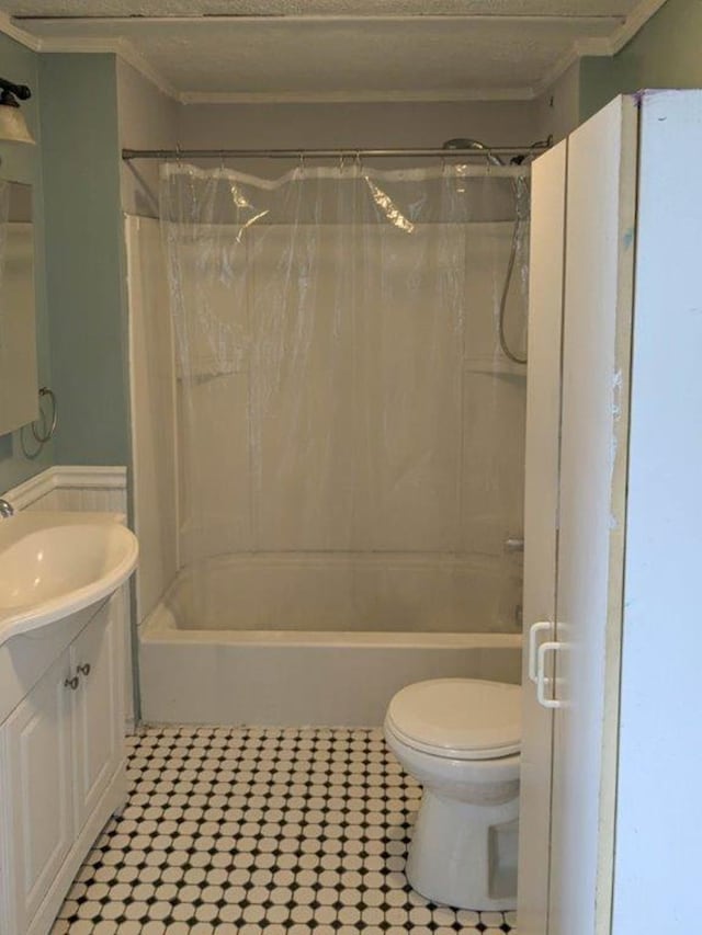 full bathroom with vanity, toilet, and  shower combination