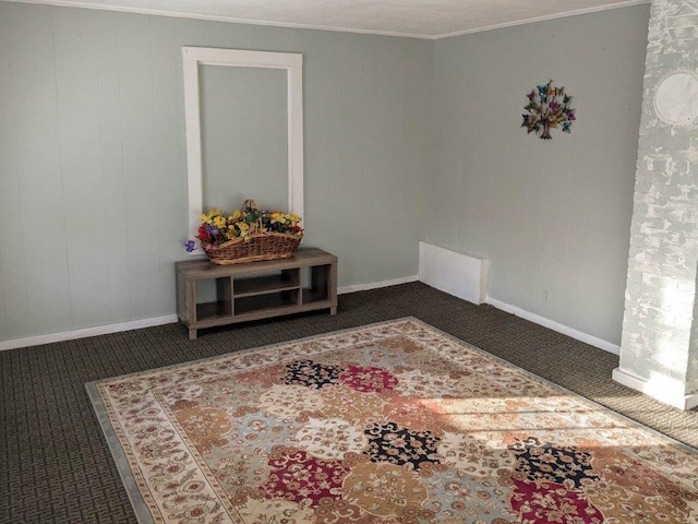 carpeted spare room with crown molding