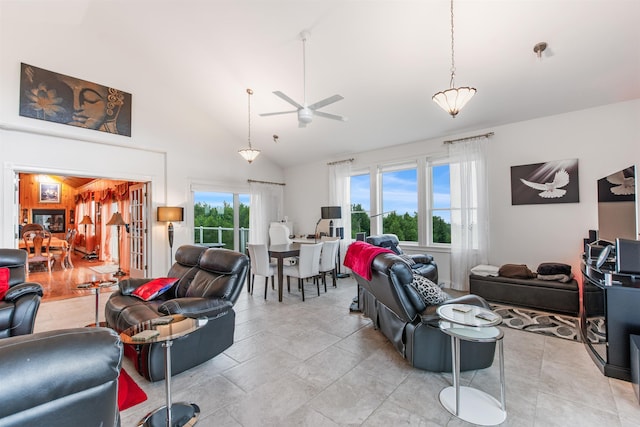 living room featuring ceiling fan and high vaulted ceiling