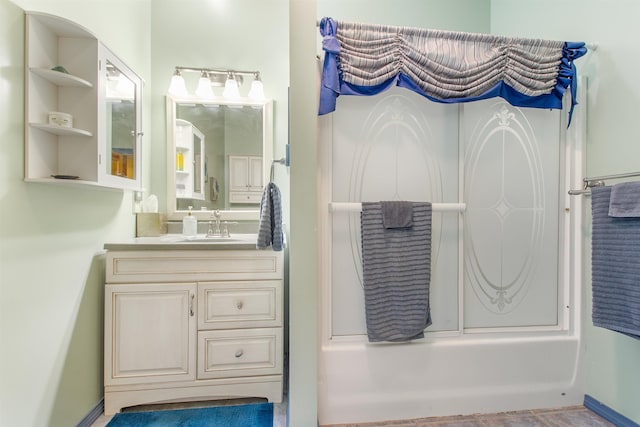 bathroom with vanity and shower / bath combination with glass door