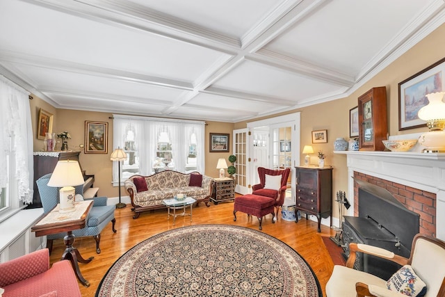 44 Winnicoash St, Laconia, NH 03246 - living room featuring beamed ceiling, a fireplace, coffered ceiling, and light wood-type flooring