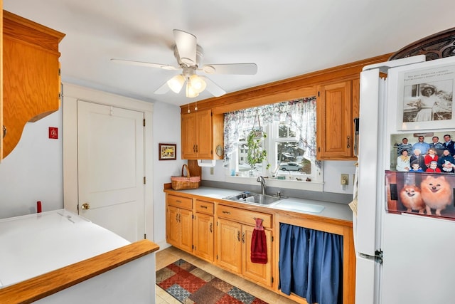 44 Winnicoash St, Laconia, NH 03246 - kitchen with white fridge, sink, and ceiling fan