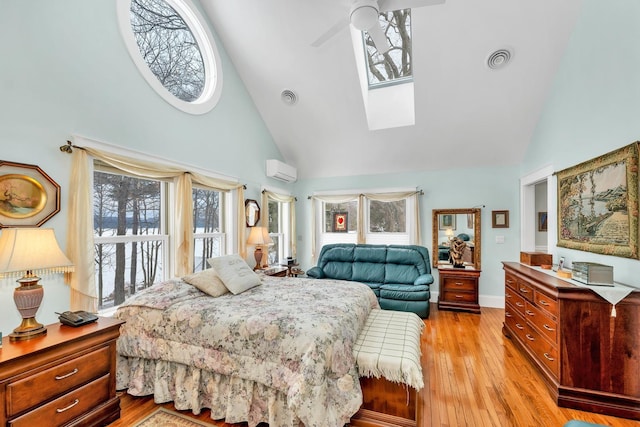 44 Winnicoash St, Laconia, NH 03246 - bedroom featuring high vaulted ceiling, light hardwood / wood-style floors, and an AC wall unit