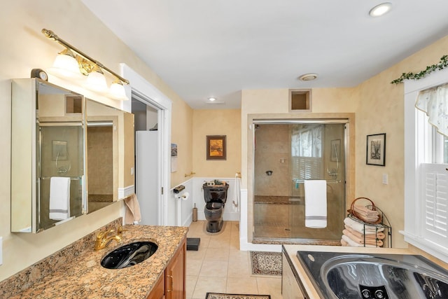 44 Winnicoash St, Laconia, NH 03246 - bathroom with vanity, separate shower and tub, and tile patterned floors