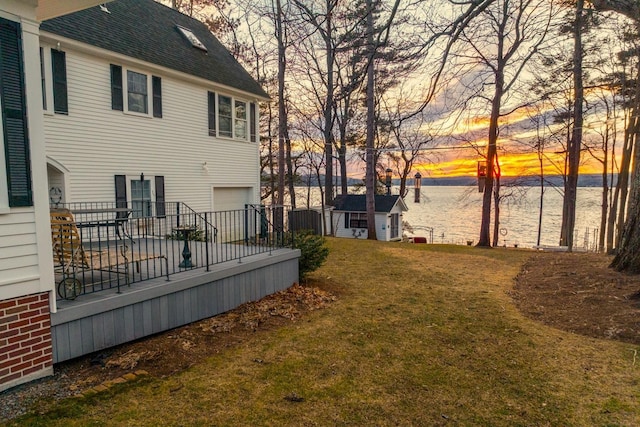 44 Winnicoash St, Laconia, NH 03246 - yard at dusk with a wooden deck and an outdoor structure