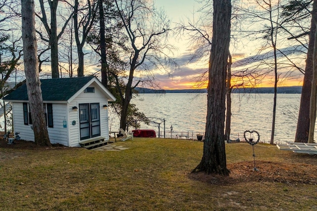 44 Winnicoash St, Laconia, NH 03246 - yard at dusk featuring a shed and a water view