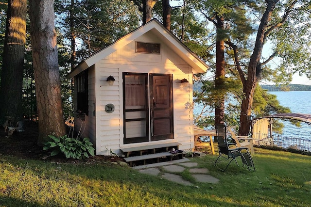 44 Winnicoash St, Laconia, NH 03246 - view of outbuilding with a water view and a lawn