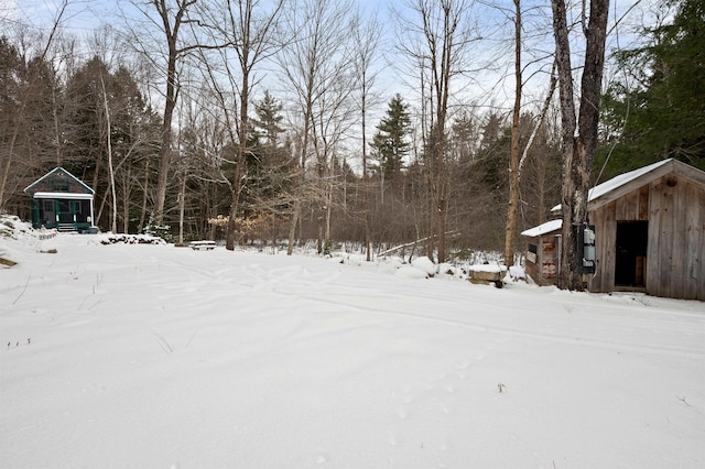 view of yard layered in snow