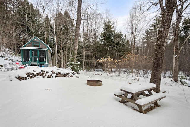 view of community with an outdoor fire pit