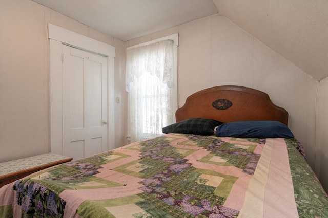 bedroom featuring vaulted ceiling