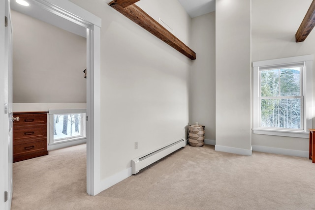 unfurnished room featuring light colored carpet and baseboard heating