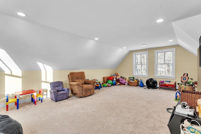 rec room with lofted ceiling and carpet