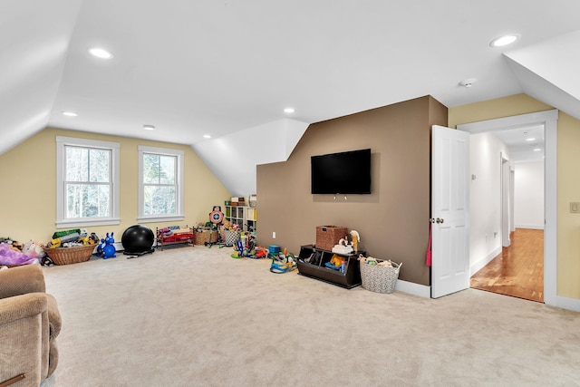 playroom with carpet and lofted ceiling